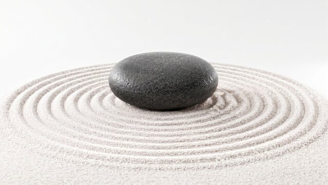 Black zen stone on raked sand pattern