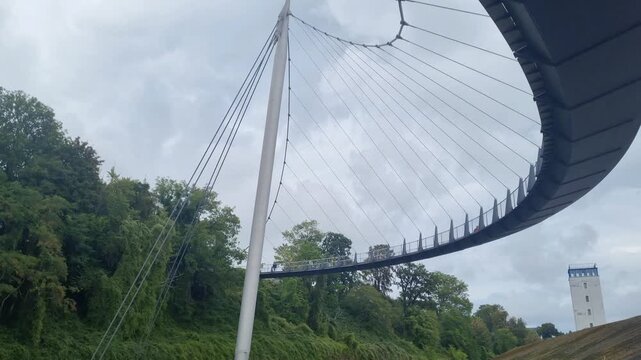 Underside of the Curving Sassnitz Bridge Against Cloudy Sky