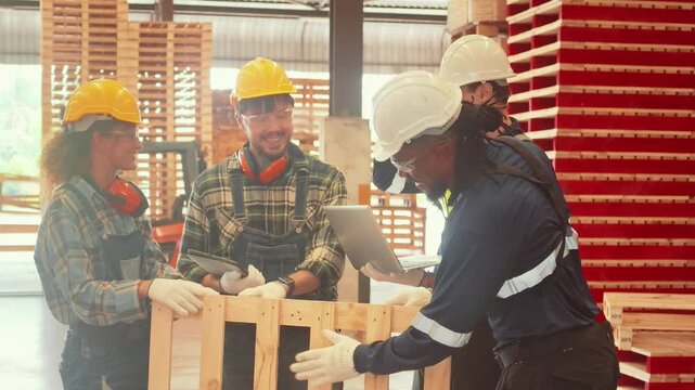 Workers collaborate on a project in a warehouse setting during the daytime