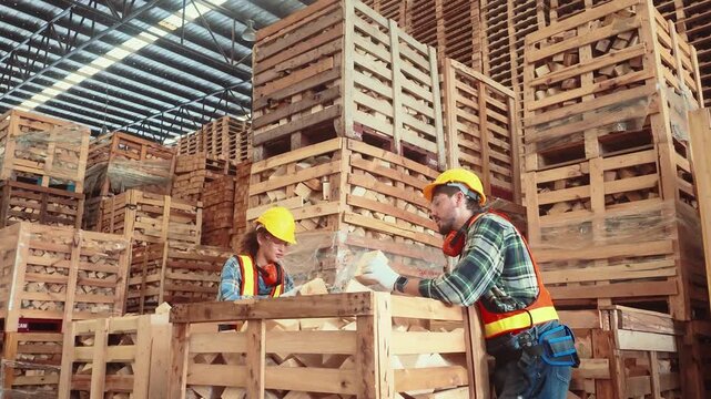 Workers sort crates in a large warehouse during the day