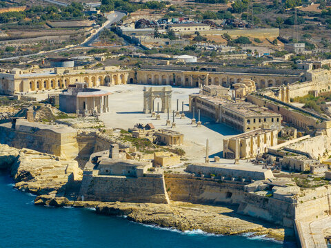 Aerial view of the historic Fort Manoel with its central parade ground, stone fortifications, and neoclassical architecture situated on the coast of Valletta, Port Region, Malta.