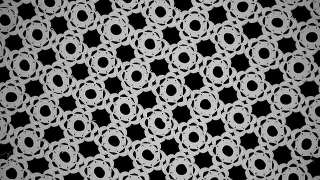 Crochet lace seamless pattern background, crocheted Grandma's Doily, detail of hand-crocheted embroidery, tablecloth, napkin isolated on black. Craft art, vintage linen rotating backdrop. Flat lay 