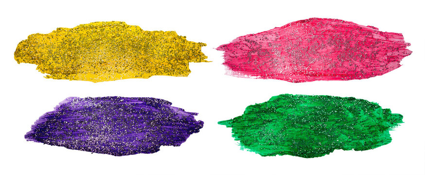  Colorful glitter paint smears in yellow, pink, purple and green with transparent background and copyspace, isolated sparkly brush stroke cutout. 