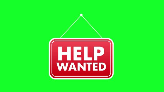 Help wanted sign hanging on a green screen for recruitment