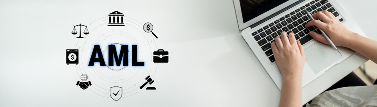 Hands Typing on Laptop with Overlay of AML Icons Representing Anti-Money Laundering Concepts and Financial Compliance in Modern Workspace. Glyphic.