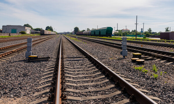 Railway Tracks and Freight Trains at Industrial Cargo Station.