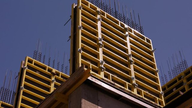 Yellow wall formwork installed for reinforced concrete construction