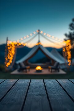 Outdoor gathering under string lights in cozy tented area with fire pit for summer event