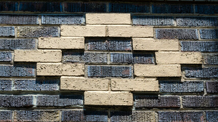 The abstract brick wall features a striking geometric pattern. Useful background © MikeCostaglio