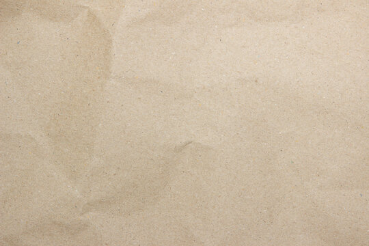 Old paper vintage texture surface for background. Recycle pale brown paper texture, Cream color recycled kraft paper texture blank with copy space for text.