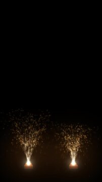 Portrait format anar firework fountains shooting golden sparks up from clay pots on black, vertical firecracker clip