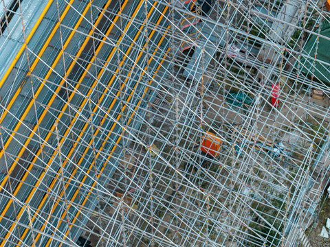 Aerial view of metal scaffolding surrounding a building facade at the Helmholtz-Zentrum Berlin Science Campus in Berlin, Berlin, Germany.