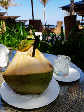 Healthy raw coconut water hydration served outdoors on a bright tropical getaway