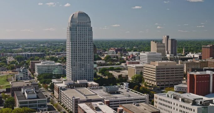 Winston-Salem North Carolina Aerial v2 low flyover toward downtown office towers and the distinctive city skyline on a clear day - Shot with 8k Camera - Oct 1st 2023