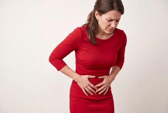 Woman Experiencing Severe Abdominal Pain and Menstrual Cramps