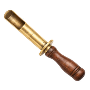 Isolated antique brass and wooden tobacco pipe reamer, a vintage