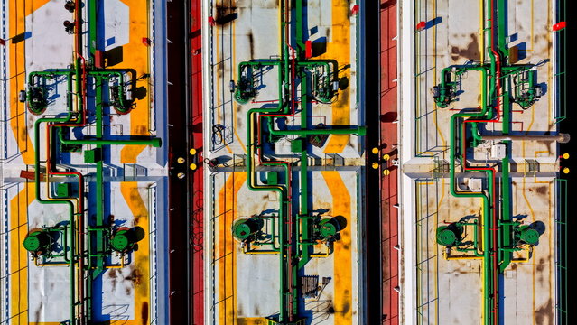 Aerial view of industrial piping systems and storage tanks at a shipyard facility in Smederevo, Podunavlje District, Serbia.