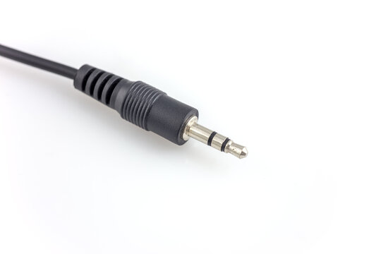 A 3.5mm TRS audio plug with a black cable, isolated on a plain white background, used for audio signal transmission.