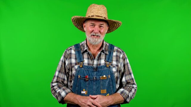 An old man wearing a straw hat and work clothes, a green screen old farmer image