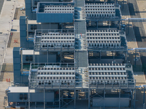 Aerial view of a large industrial datacenter featuring rows of cooling units and metal infrastructure in The Netherlands.