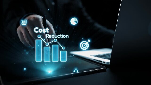 This image illustrates cost reduction strategies using digital visuals and graphs on a laptop, highlighting finance and technology in a professional workspace. Qubit