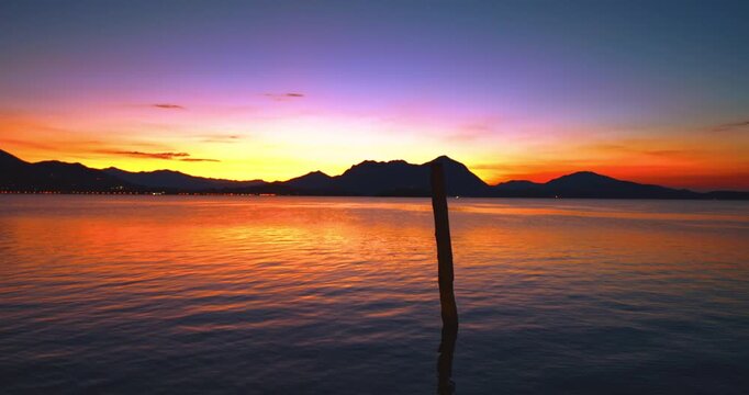 Amazing sunrise on the pier of Stresa in Italy.