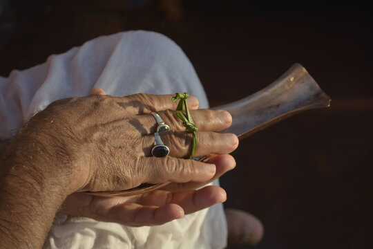 close up of a hand holding Kosha Kushi	