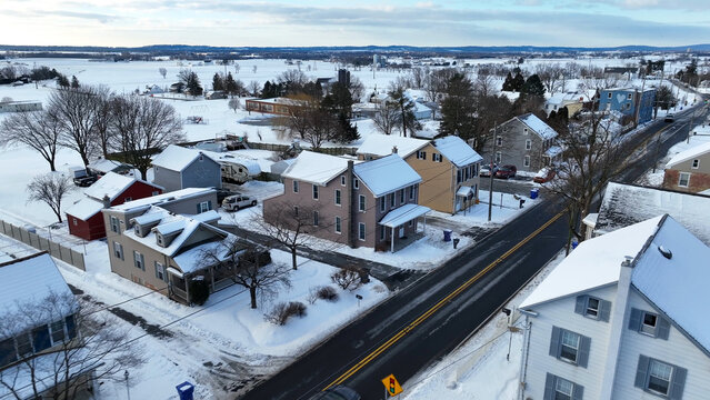 Aerial view of snow-covered residential houses and streets in the Sporting Hill neighborhood of Hampden Township, Pennsylvania, United States.