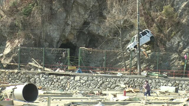 Car Stuck On Cliffside In Aftermath Of Tsunami In Japan