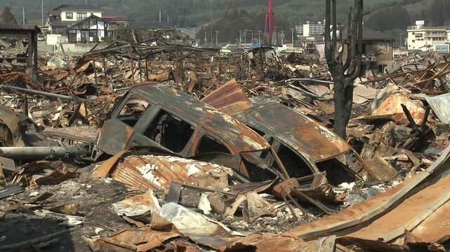 Burnt Out Vehicles And Debris In Aftermath Of Tsunami In Japan