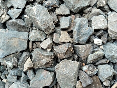 Macro view of uneven crushed stone surface for industrial or landscaping backgrounds