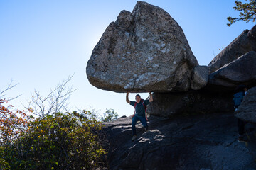 Balanced Boulder Against Blue Sky © Taras Vovchuk