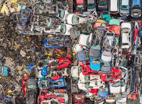 Aerial view of end of life vehicle recycling facility with stacks of crushed and dismantled cars in Gdansk, Pomeranian Voivodeshi, Poland.