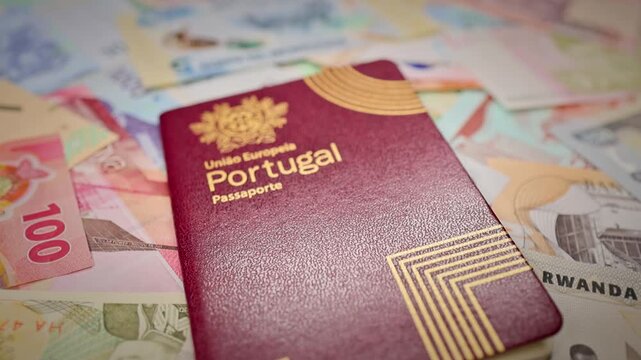 Portugal Passport With Rwanda Banknotes