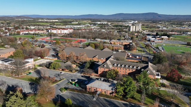 Aerial view of the campus buildings, parking lots, and athletic fields in Harrisonburg, Virginia, United States.