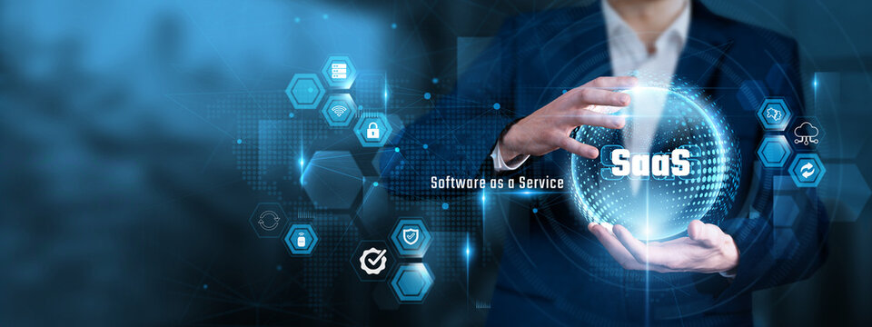 Businessman Hand Hold SaaS and global Software as a Service, Cloud Application Platform, Virtual Enterprise System, Subscription Tech Architecture, Digital Data Network
