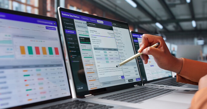 Marketing Manager Studies Customer Behavior On Laptop