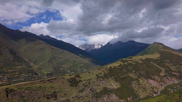4K Aerial View of Rolling Cloud Sea Over Tibetan Snow Mountains and Grasslands