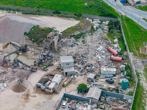 Aerial view of the industrial waste processing facility in Philippi featuring piles of gravel, sorting machinery, and debris in Cape Town, Western Cape, South Africa.