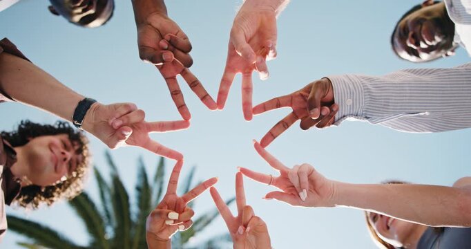 People, unity or hands together with star sign for social cohesion, inclusion or solidarity in park. Low angle, group or community with gesture or shape for outdoor synergy, collaboration or teamwork