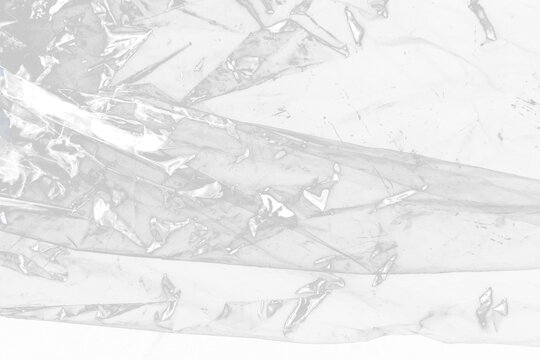 Crumpled Plastic Wrap Texture on Transparent Background with High Contrast Light Reflections