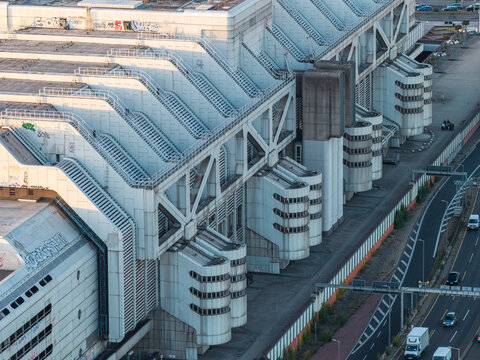 Aerial view of the Internationales Congress Centrum ICC, a landmark of Brutalist architecture with white structural beams and cylindrical sections in Berlin, Berlin, Germany.