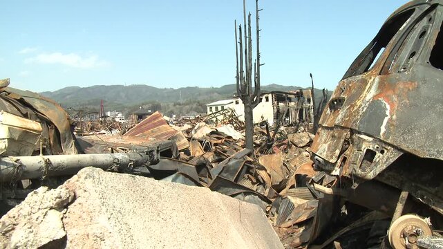 Piles Of Burnt Out Debris In Aftermath Of Tsunami In Japan