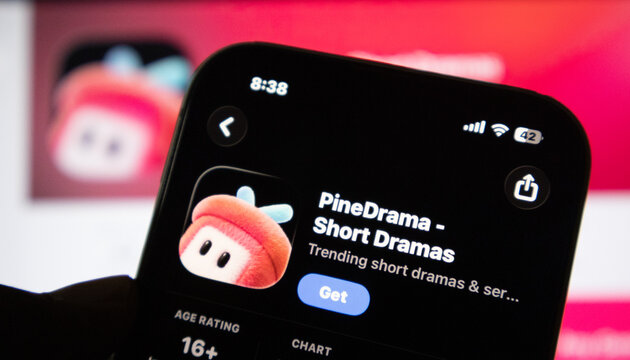 Smartphone displaying pinedrama app store interface on dark screen.