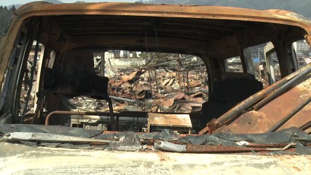 Remains Of Burnt Out Vehicle In Aftermath Of Tsunami In Japan