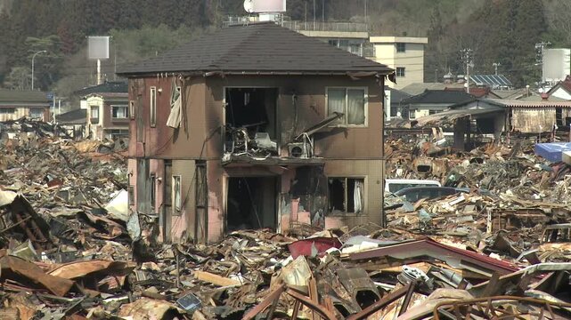 Burnt Out Building And Debris In Aftermath Of Tsunami In Japan