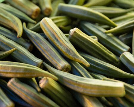 close up of okra in a pile at the markets