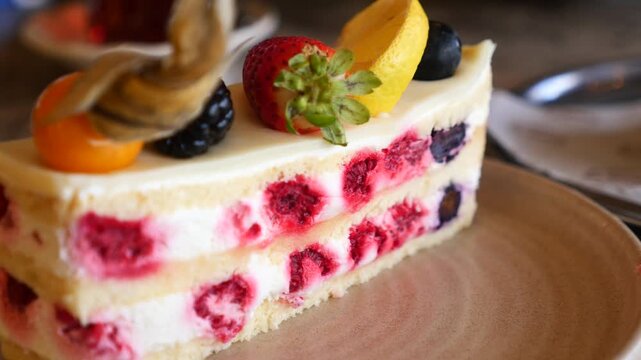 Slice of berry cheesecake on plate, delicious dessert with fresh fruit, sweet treat for breakfast or snack