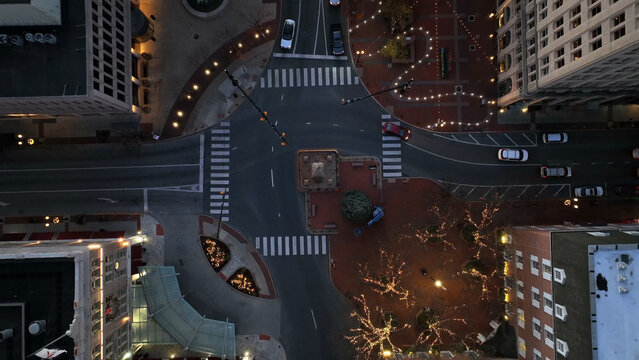 Aerial view of the intersection in Lancaster City decorated with festive Christmas lights at night, featuring illuminated trees and city streets in Lancaster, Pennsylvania, United States.