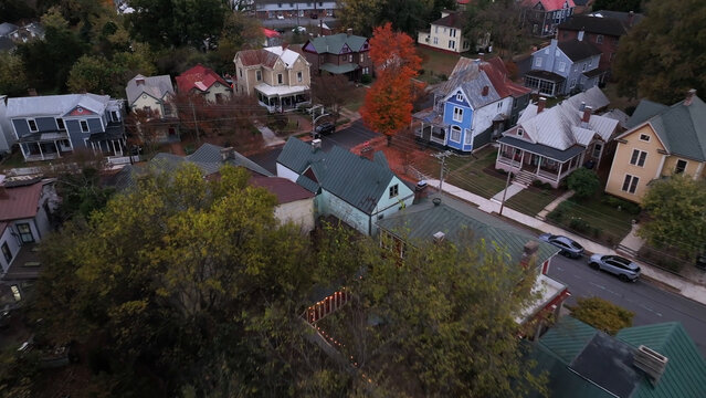 Aerial view of a residential neighborhood with historic houses and vibrant autumn foliage lining the streets in Danville, Virginia, United States.